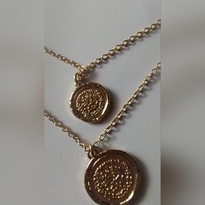 Gold Coin Pendant Necklace With A Four Stone Ring Multiple Color Stones.